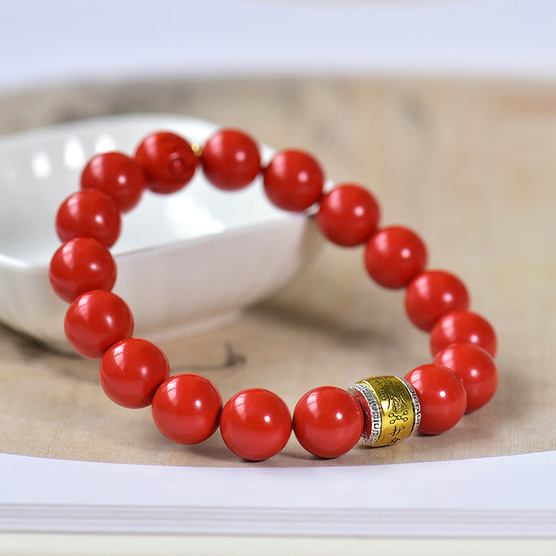 Armband aus Kunstharz in Zinnoberrot mit graviertem Messinganhänger 